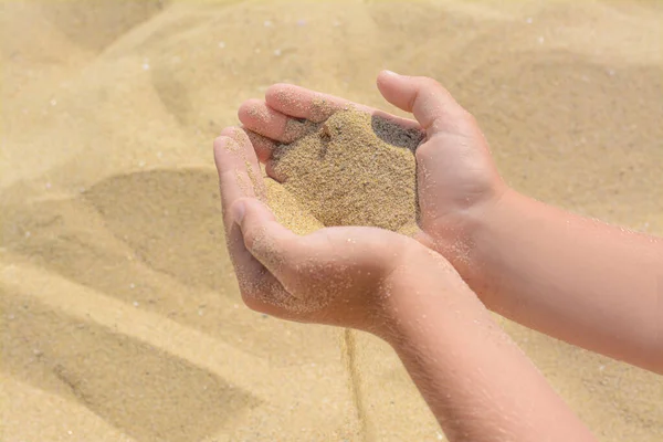 Child Pouring Sand Hands Beach Closeup Fleeting Time Concept — Fotografia de Stock