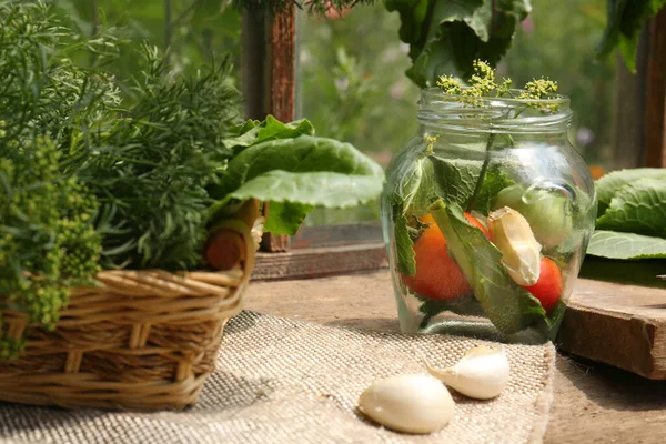 Fresh Green Herb Jar Tomatoes Garlic Cloves Wooden Table Indoors — Stock Photo, Image