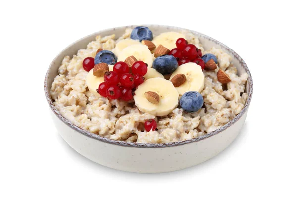 stock image Ceramic bowl with oatmeal, berries and banana slices isolated on white