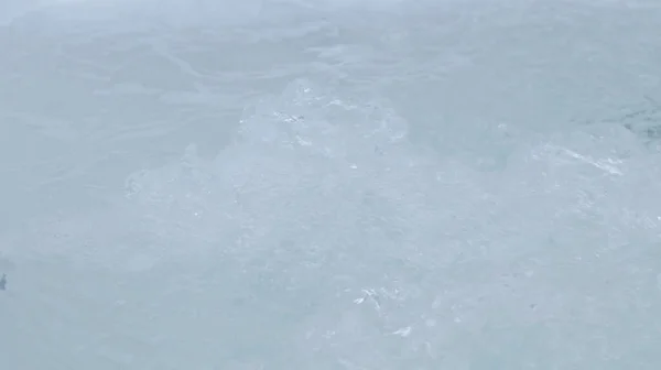 Water bubbling in hot tub, closeup view