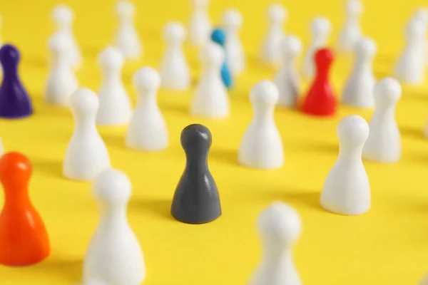 Colorful Pawns Yellow Background Closeup Social Inclusion Concept — Stockfoto