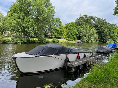 Beautiful view of canal with moored boats on sunny day