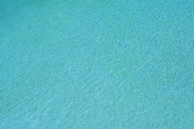 Calm clear water in swimming pool outdoors