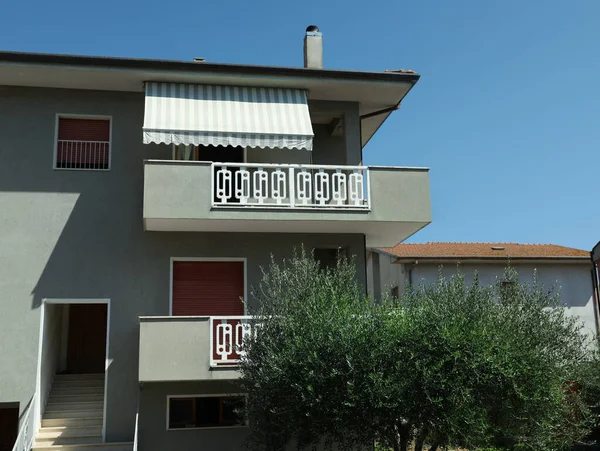 Stock image Exterior of residential building with balconies on sunny day