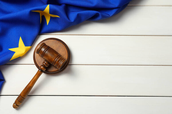 Judge's gavel and flag of European Union on white wooden table, flat lay. Space for text
