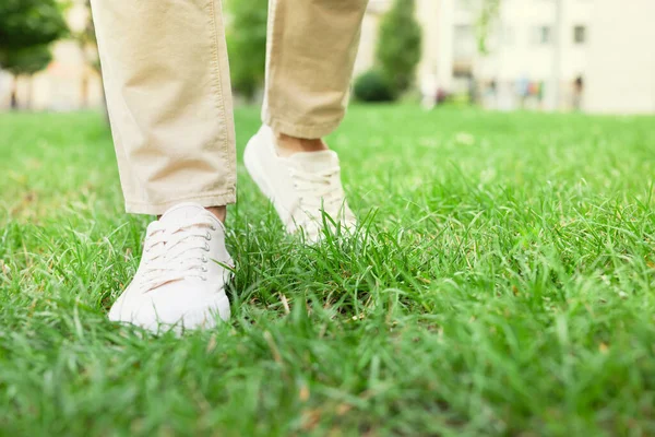 Man Stylish Sneakers Walking Green Grass Outdoor Closeup — Φωτογραφία Αρχείου