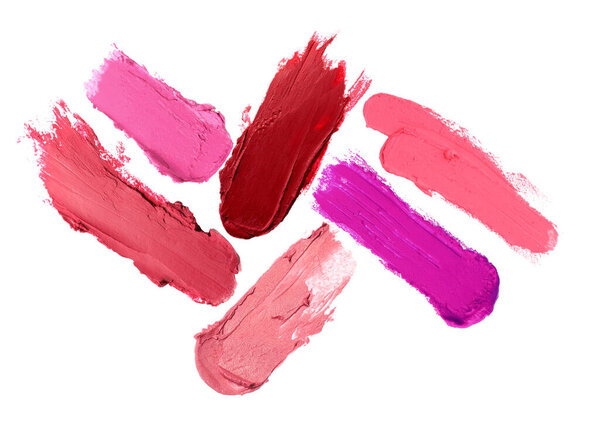 Различные мазки помады на белом фоне. Косметический продукт