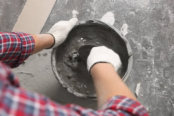 Worker Trowel Mixing Concrete Bucket Indoors Closeup — Stock Photo, Image