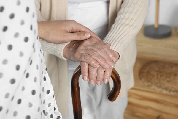 Caregiver Elderly Woman Walking Cane Home Closeup — Foto de Stock