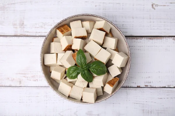 Bowl Delicious Smoked Tofu Basil White Wooden Table Top View — Stock Photo, Image