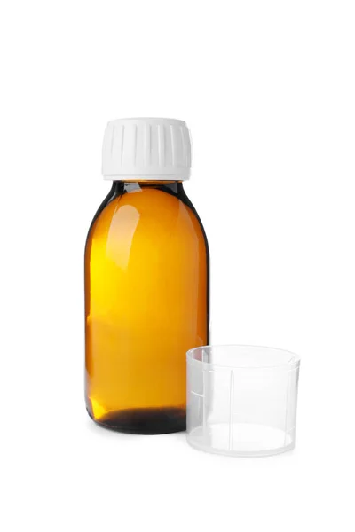 用白底杯测量的瓶装糖浆 感冒药和感冒药 — 图库照片