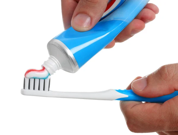 Man Applying Toothpaste Brush White Background Closeup — Zdjęcie stockowe