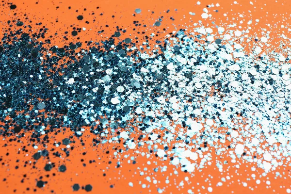 Stock image Shiny bright blue glitter on orange background