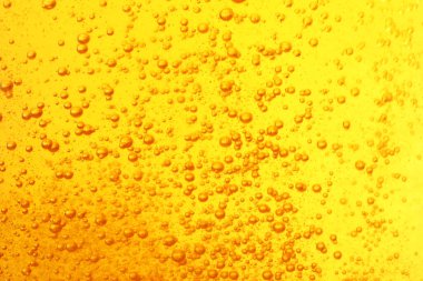 Tasty beer with bubbles as background, closeup
