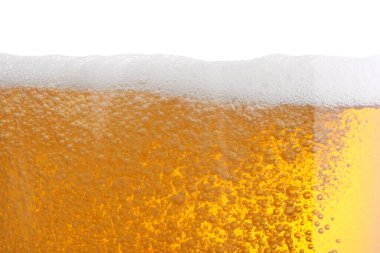 Tasty beer with foam in glass, closeup clipart