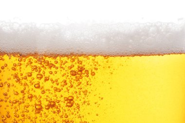 Tasty beer with foam in glass, closeup