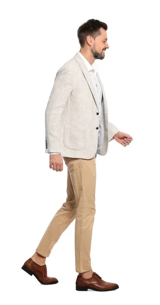 穿着时髦服装的男人在白色背景上行走 — 图库照片