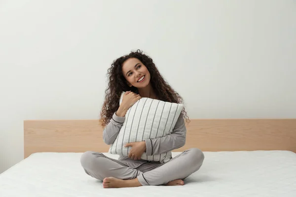 Happy Young African American Woman Hugging Pillow Bed Comfortable Mattress — Stockfoto