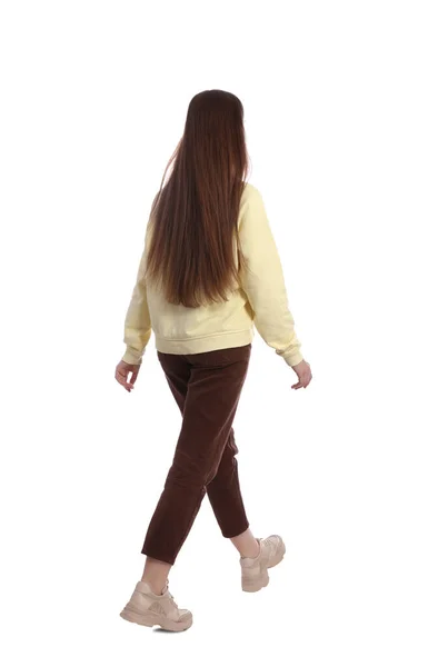 Mujer Joven Traje Casual Caminando Sobre Fondo Blanco Vista Trasera —  Fotos de Stock