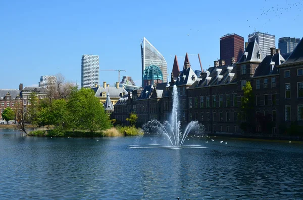 stock image Hague, Netherlands - May 2, 2022: Beautiful view of city street with modern buildings and fountain