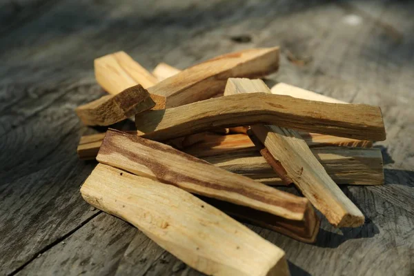 stock image Palo santo sticks on wooden table, closeup