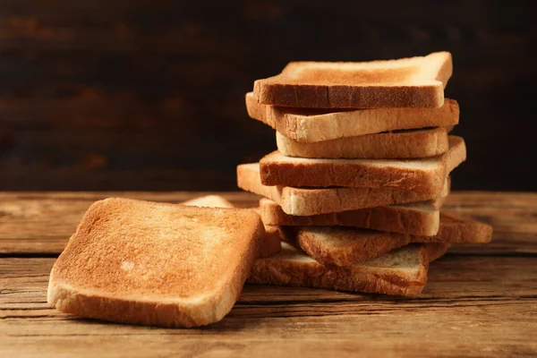 Slices Tasty Toasted Bread Wooden Table —  Fotos de Stock