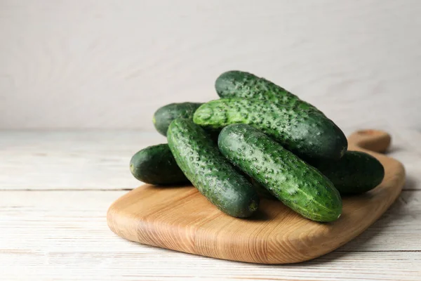 Board Fresh Ripe Cucumbers White Wooden Table Space Text — Stock Photo, Image