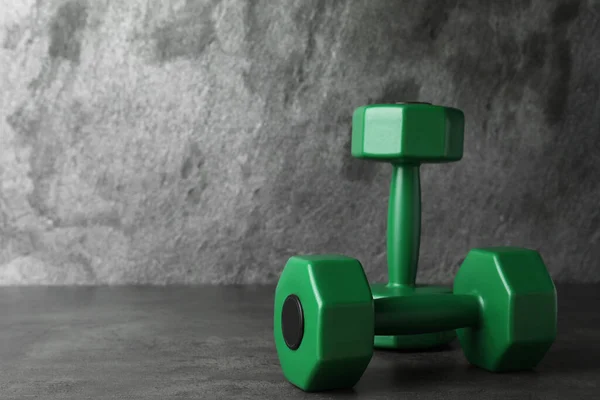 Green Vinyl Dumbbells Table Grey Background Space Text — 스톡 사진