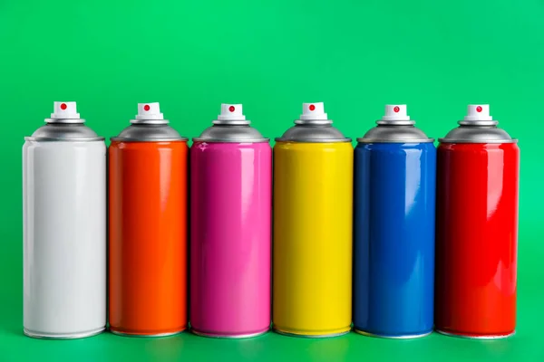 Colorful Cans Spray Paints Green Background — Stock Photo, Image