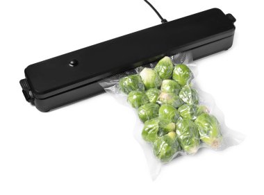 Sealer for vacuum packing and plastic bag with Brussels sprouts on white background clipart