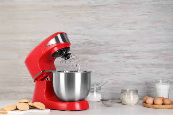 stock image Composition with modern red stand mixer and different products on white table