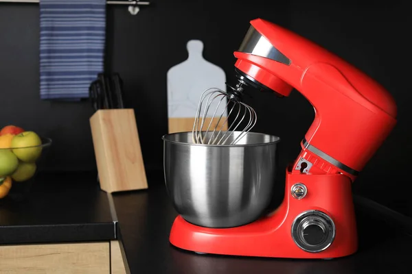 Modern stand mixer on countertop in kitchen. Home appliance