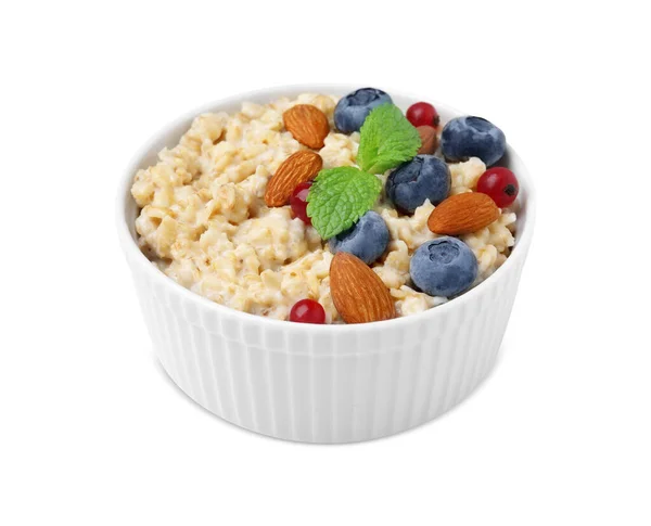 stock image Ceramic bowl with oatmeal, berries. almonds and mint isolated on white