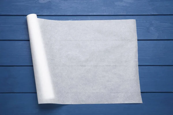 Roll Baking Paper Blue Wooden Table Top View — Stock Photo, Image