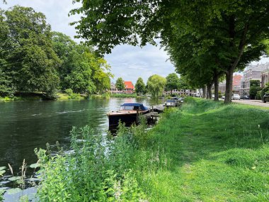 Beautiful view of canal with moored boats on sunny day