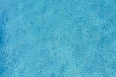 Rippled water in swimming pool as background