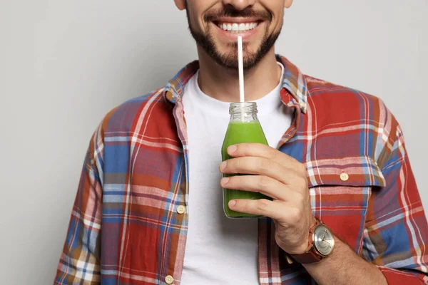 Man Drinking Delicious Juice Grey Background Closeup — Stock Photo, Image