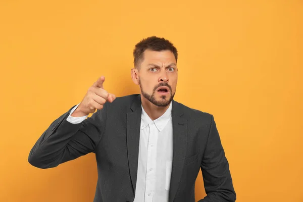 Aggressive Man Pointing Orange Background Hate Concept — Stock Photo, Image