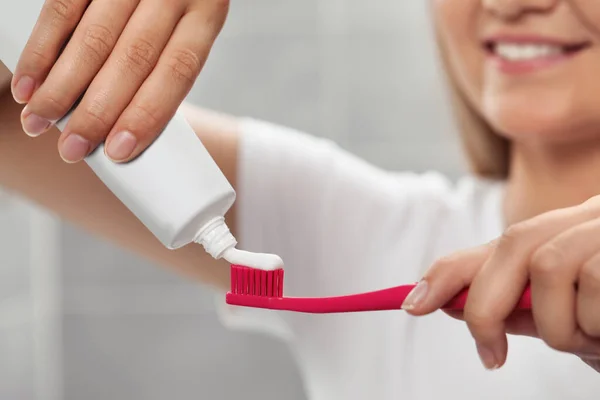 Woman Applying Toothpaste Brush Bathroom Closeup — Stock Photo, Image