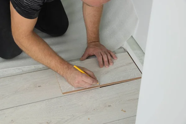 Man Using Pencil Installation New Laminate Flooring Closeup — Stock Photo, Image