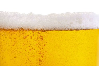 Tasty beer with foam in glass, closeup