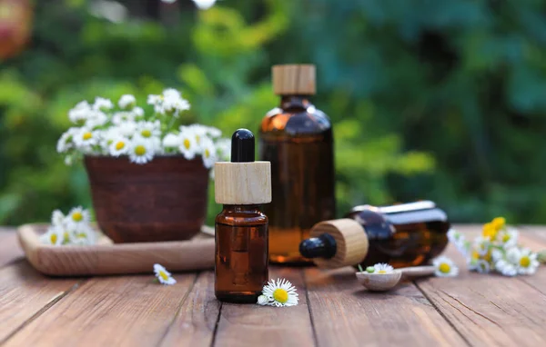 Bottles Essential Oil Flowers Wooden Table — Stock Photo, Image