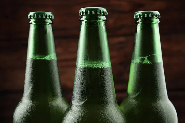 Many Bottles Beer Wooden Background Closeup — Stock Fotó