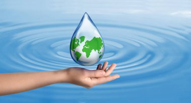 Woman holding icon of Earth in drop on blue background, closeup. Water save concept clipart