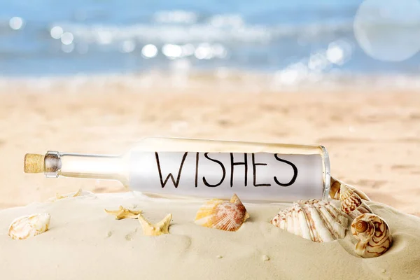 Corked Glass Bottle Rolled Paper Note Seashells Sandy Beach Ocean — Stock Photo, Image