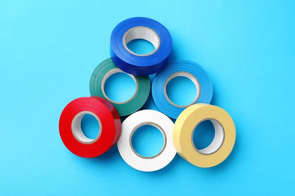 Colorful Insulating Tapes Light Blue Background Flat Lay — Stock Photo, Image
