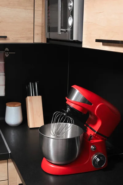 Modern stand mixer on countertop in kitchen