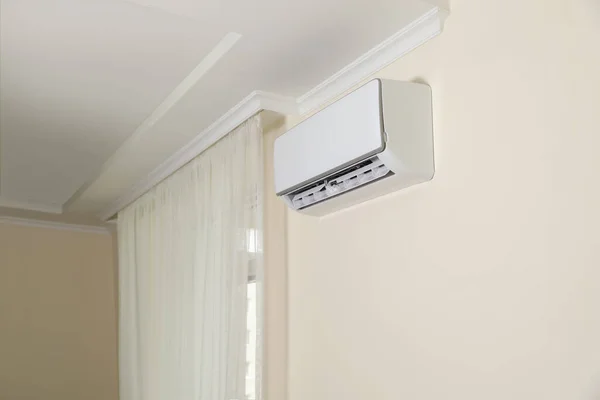 stock image Modern air conditioner on white wall indoors