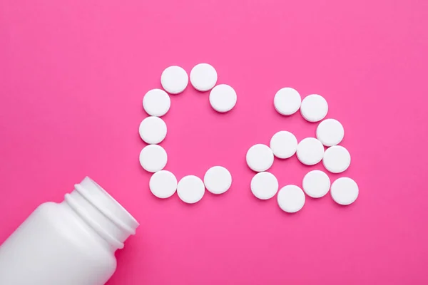 Calcium Symbol Made White Pills Open Bottle Pink Background Flat — Stock Photo, Image