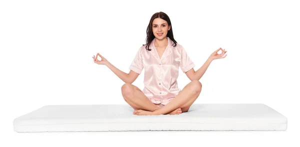 Mujer Joven Meditando Sobre Colchón Suave Sobre Fondo Blanco —  Fotos de Stock
